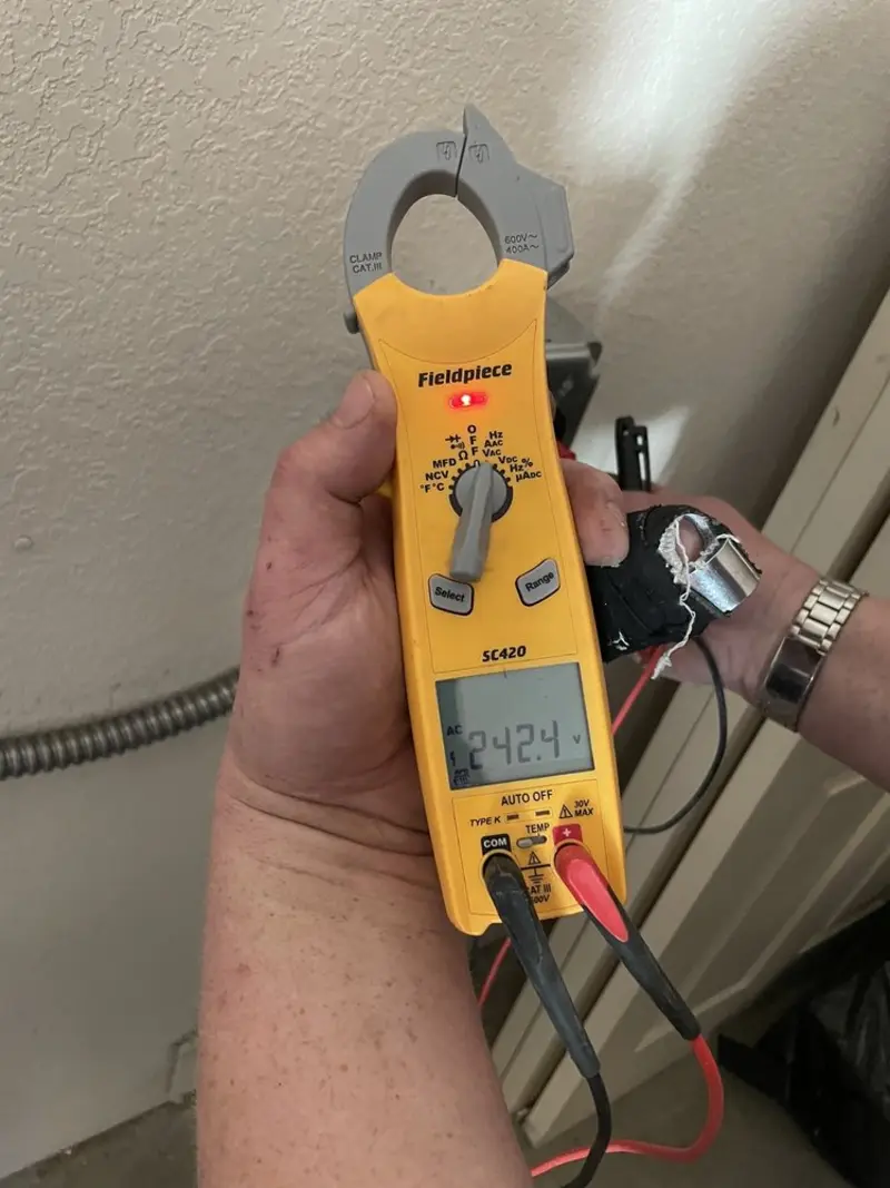Voltage testing with clamp meter during Electrical Installation Services in Pitman